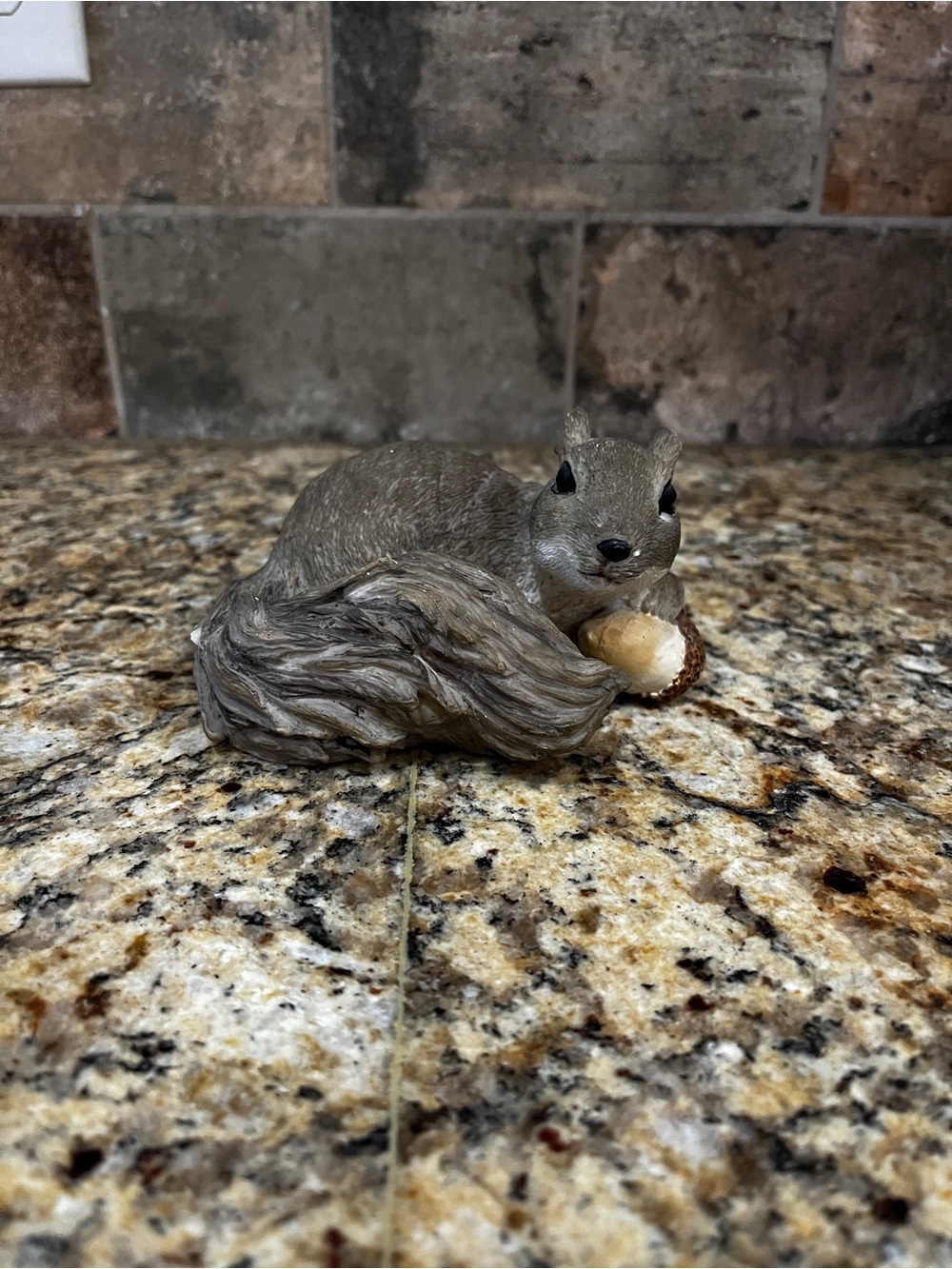 Vintage Ganz Grey squirrel figurine with acorn weathered guy resin